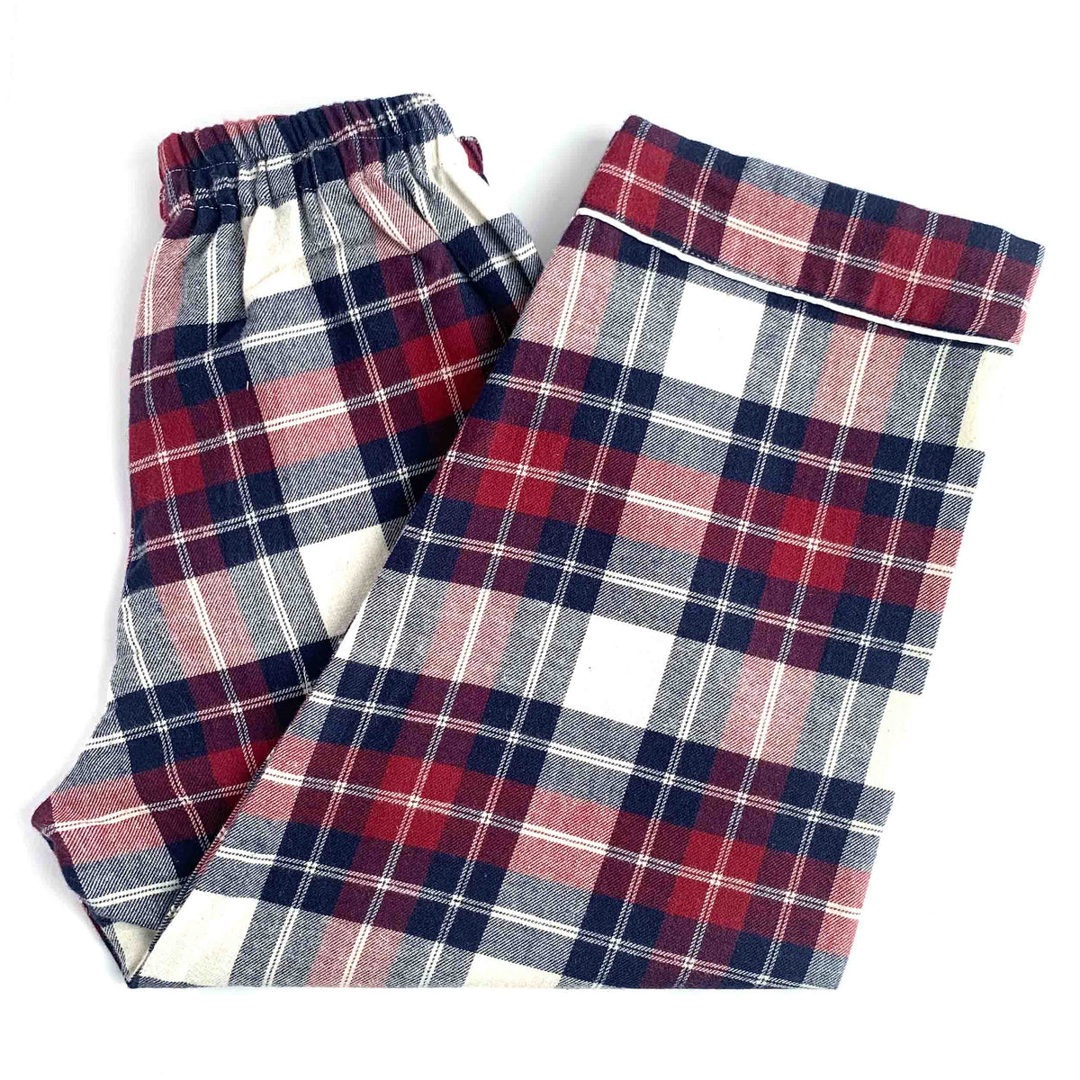 A pair of plaid pajama pants folded on a white background, featuring a red, navy blue, gray, and white tartan pattern.