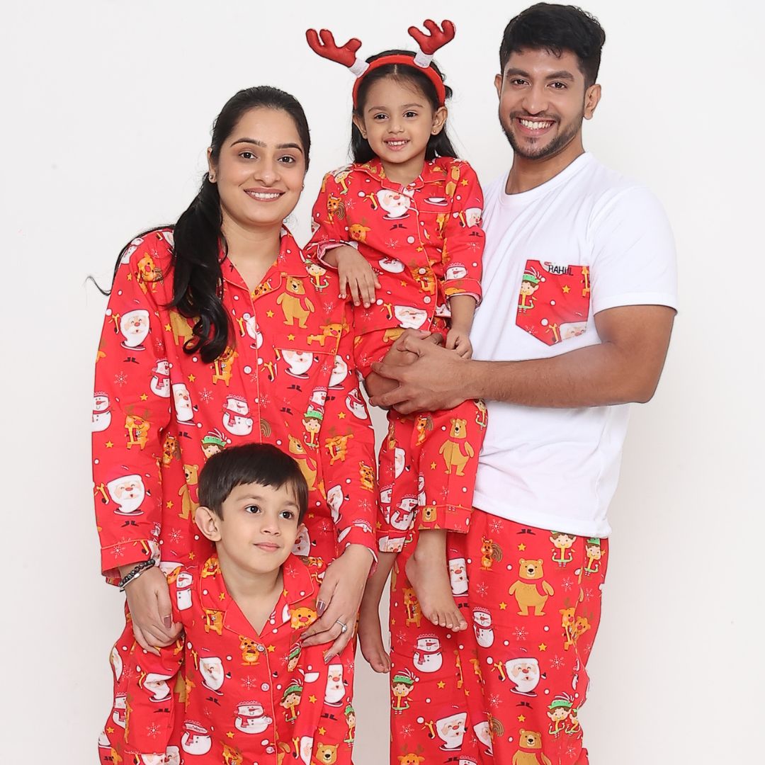 A red Santa Claus night suit with printed Christmas-themed characters, including Santa, reindeer, and snowmen