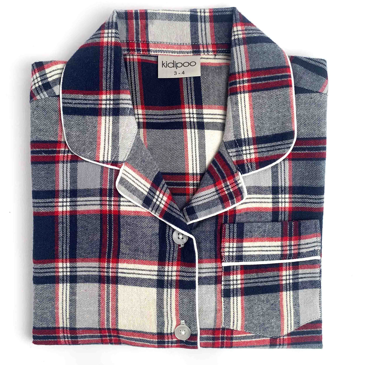 A folded plaid pajama shirt with a navy, red, white, and gray tartan pattern and white piping, featuring a button-down front and a visible 'kidipoo' brand label.