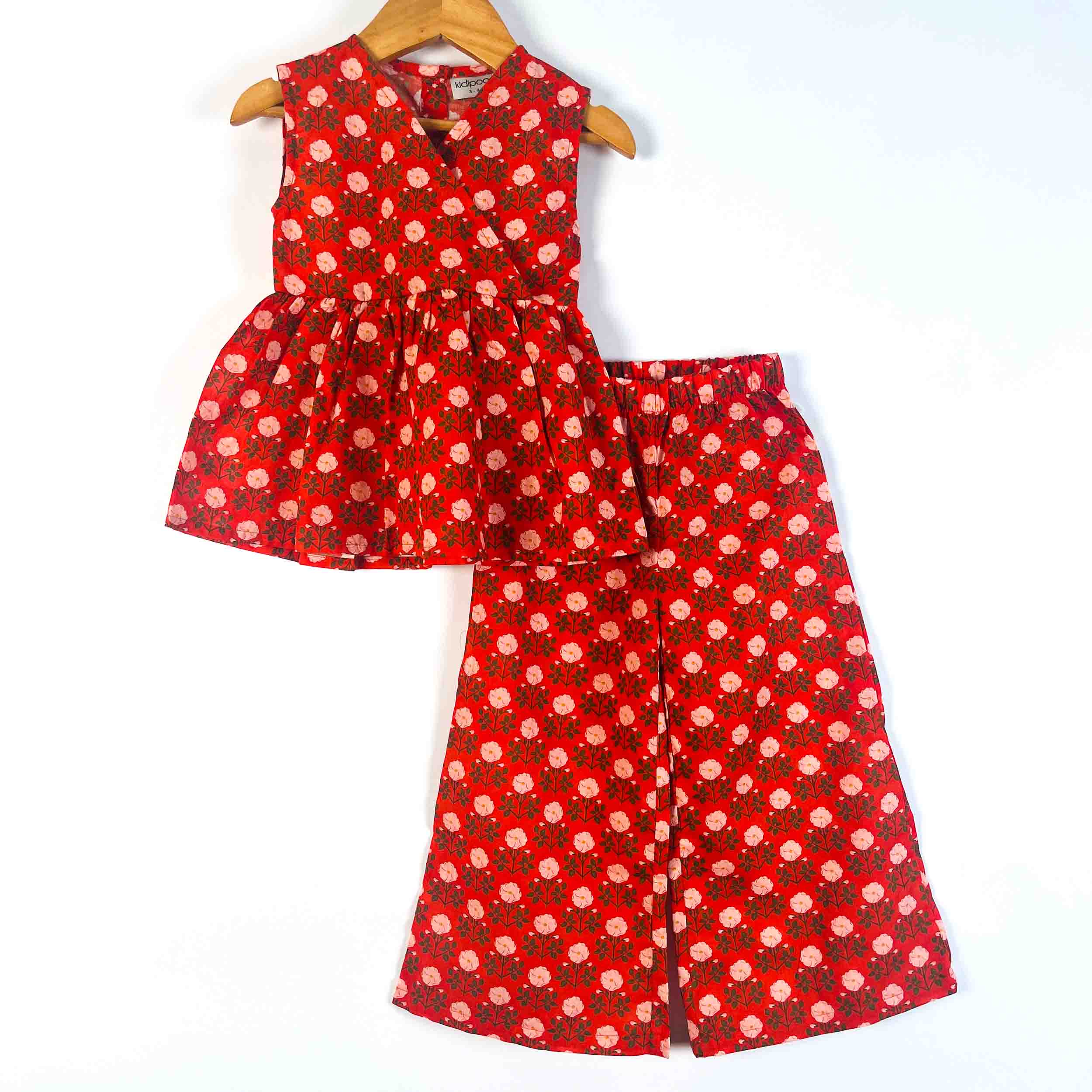 A two-piece girls' outfit set consisting of a sleeveless peplum top and matching wide-leg Pant