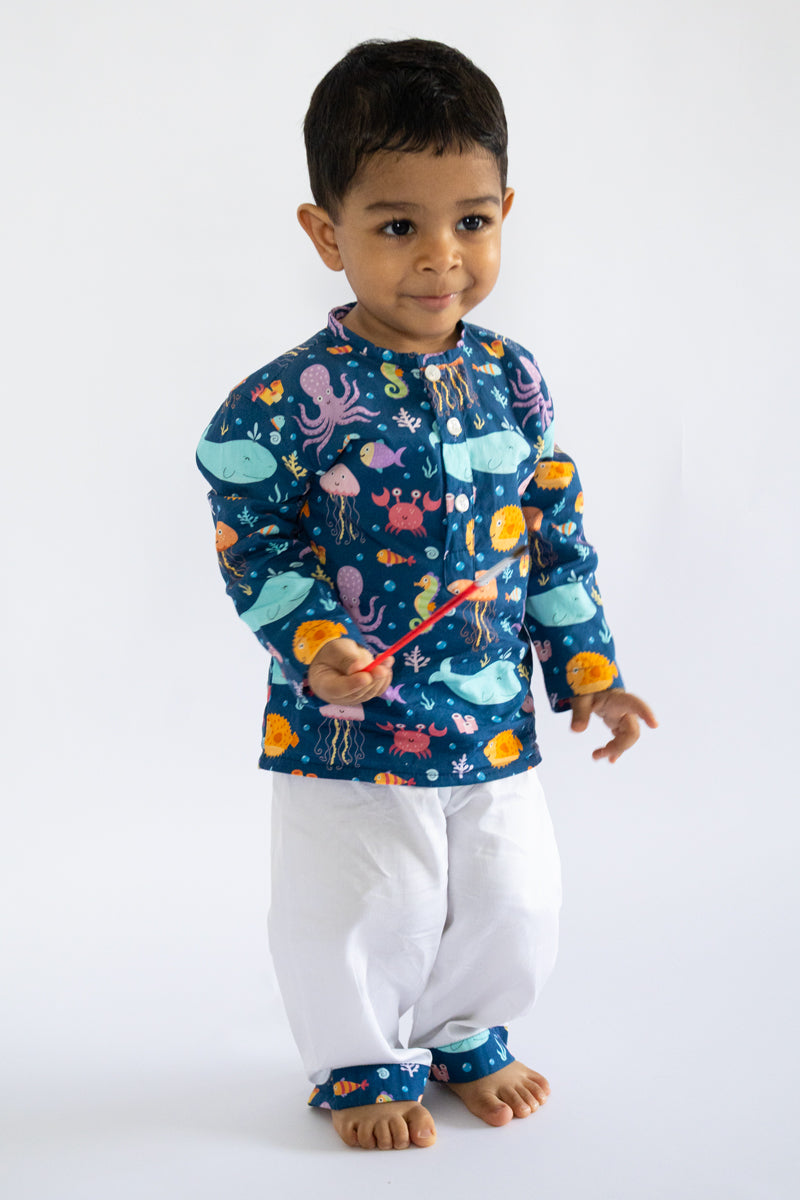 Kid wearing Kidipoo sea creatures print cotton kurta pajama set front view kids ethnic outfit