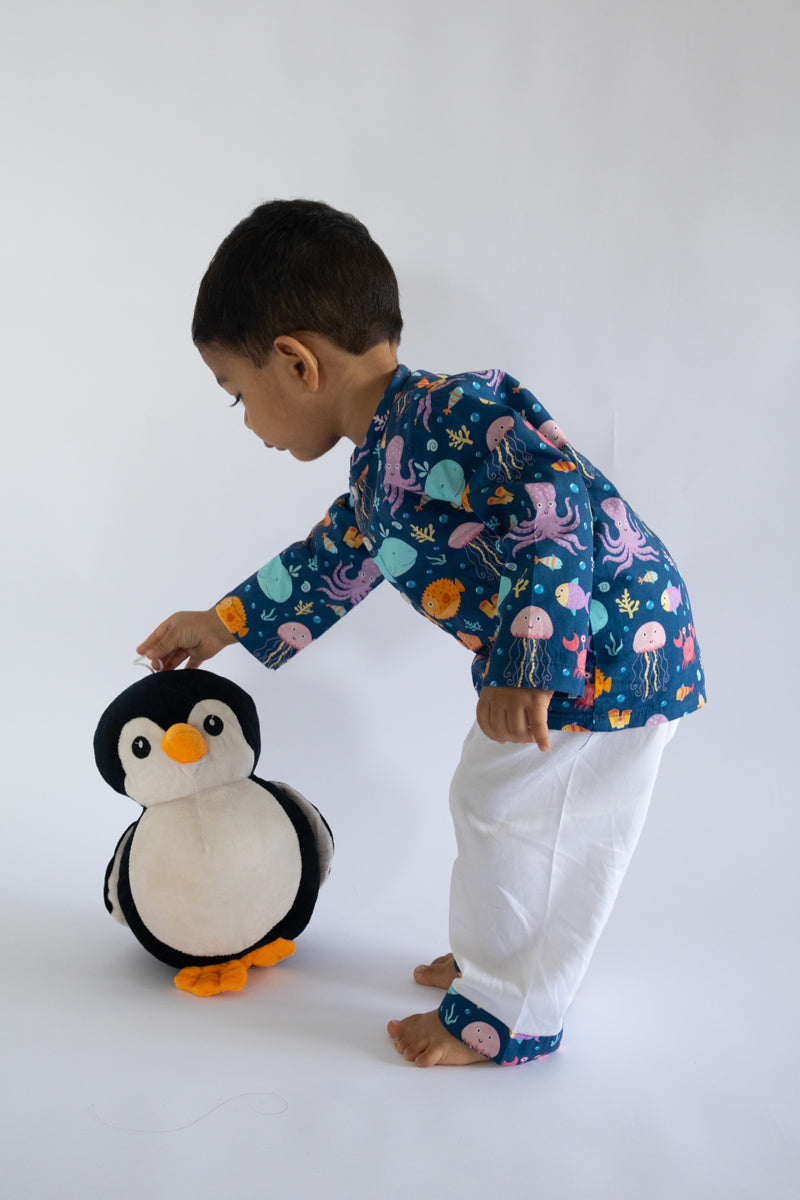 "Kid wearing Kidipoo sea creatures print cotton kurta pajama set playing pose comfortable kids wear"