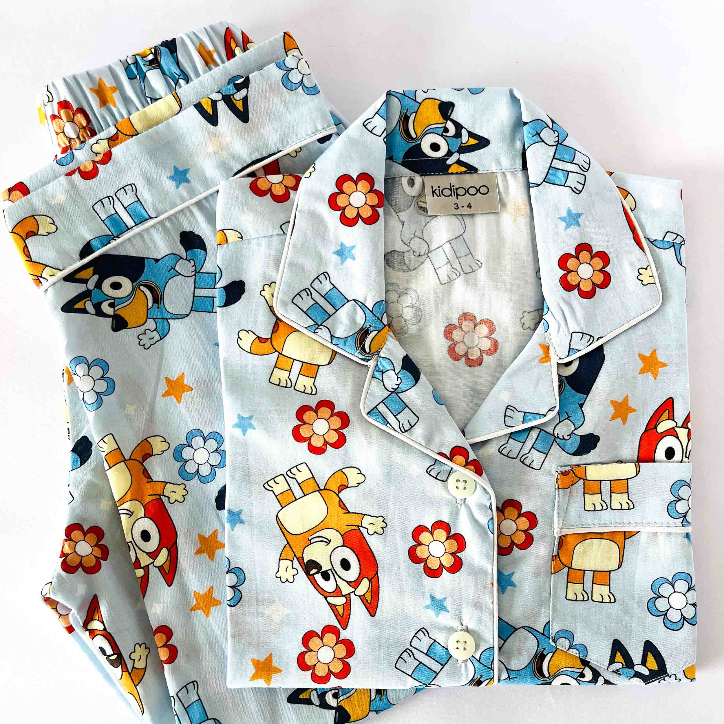 Kids blue cotton night suit set with cartoon character and floral print 