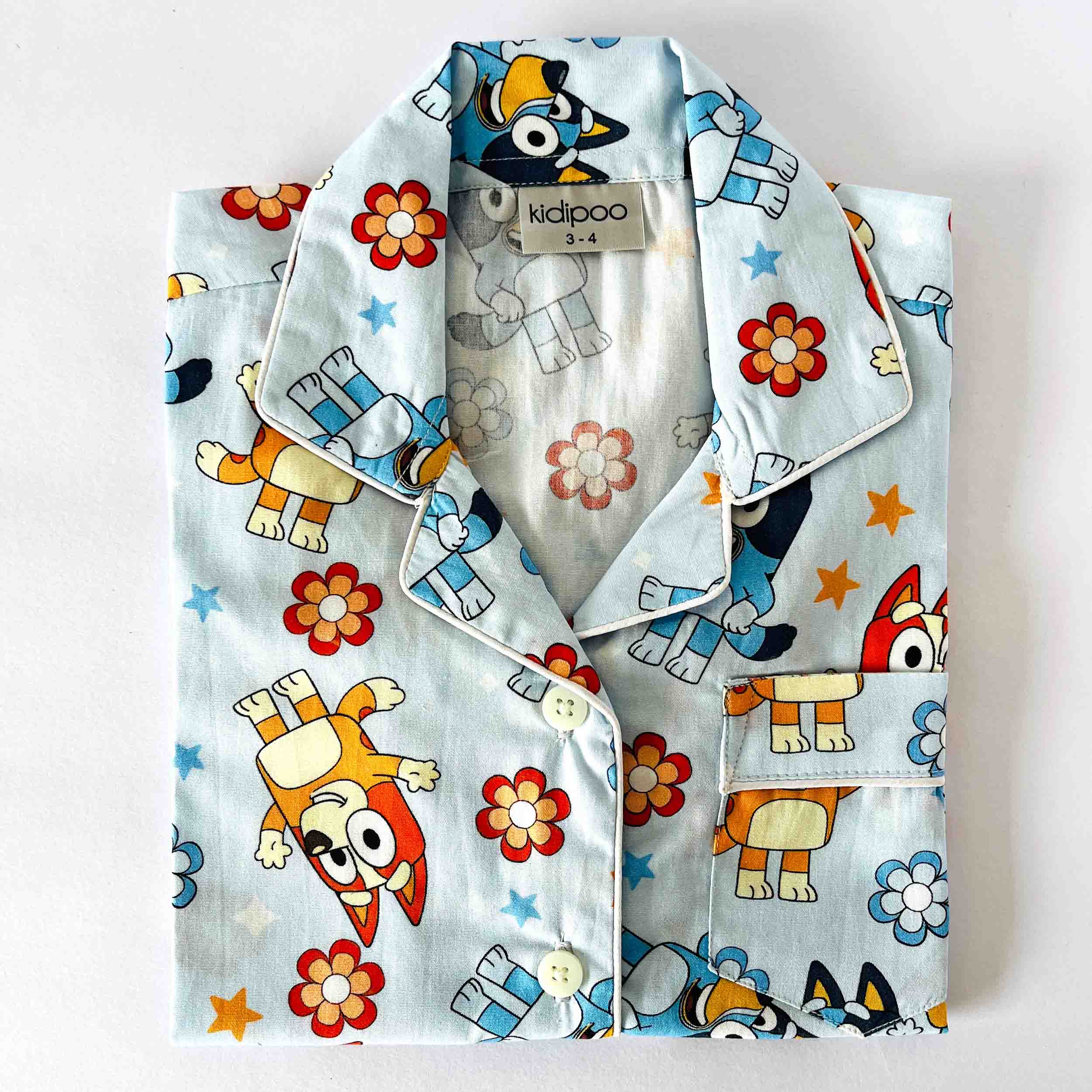 Kids blue cotton night suit shirt with cartoon character and floral print 
