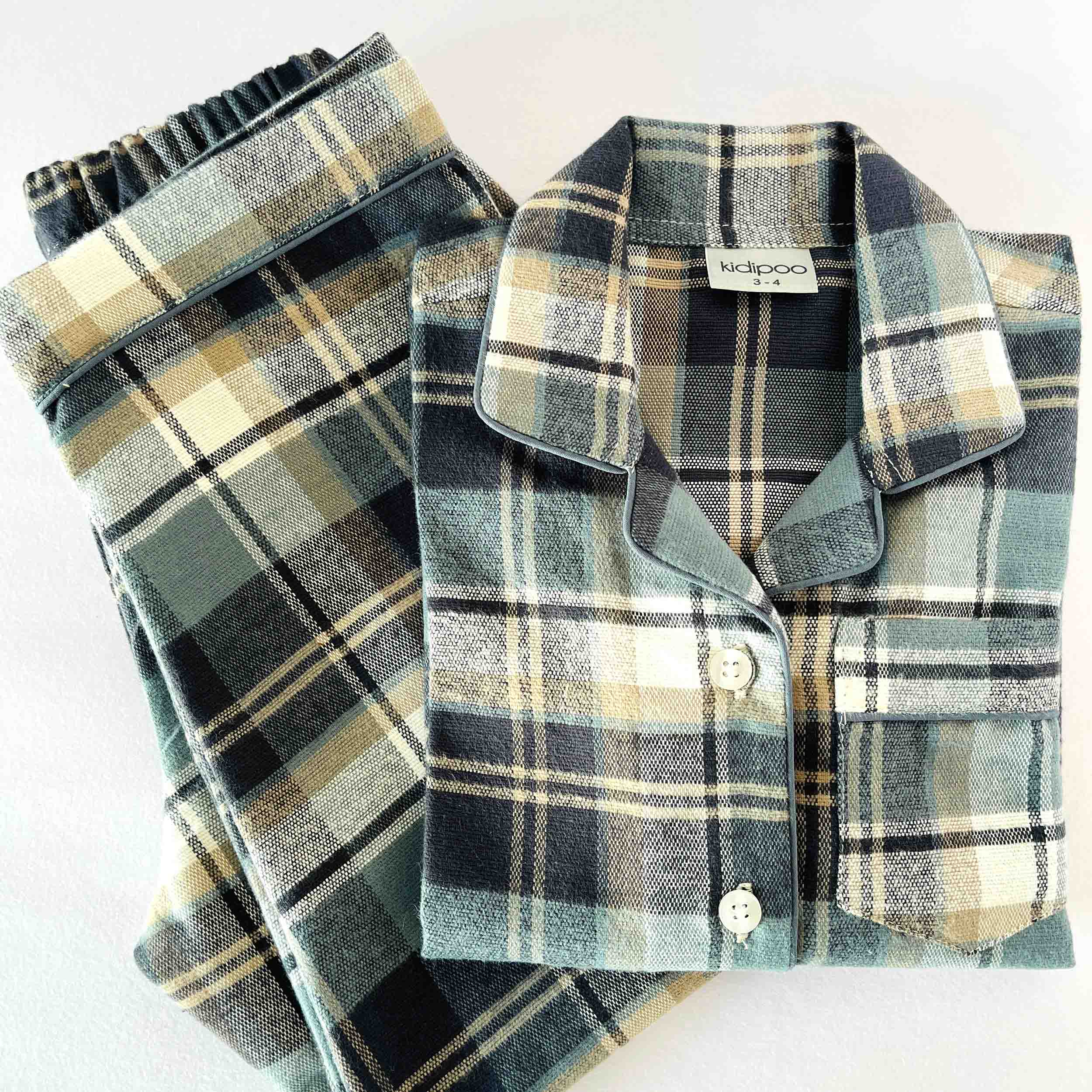 Plaid shirt with a collar and buttons on a white background