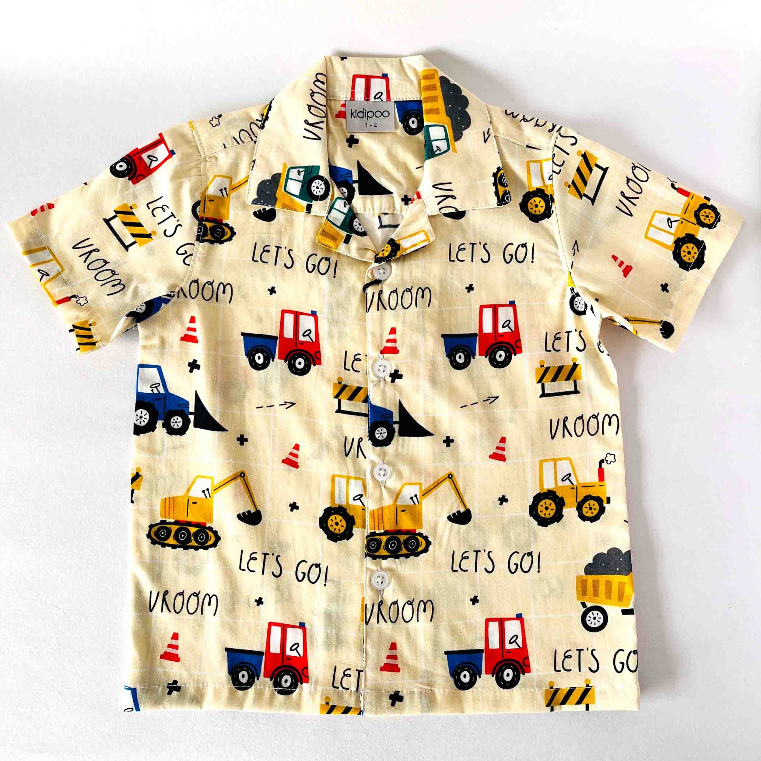 Children's shirt with vehicle pattern on a white background