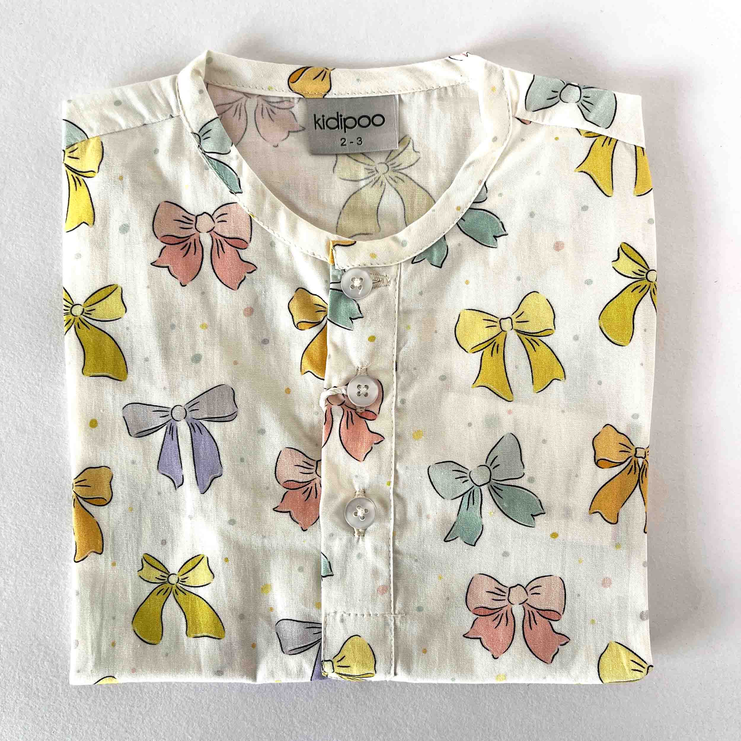 Kids cotton night shirt with bows print and round neck long sleeve design