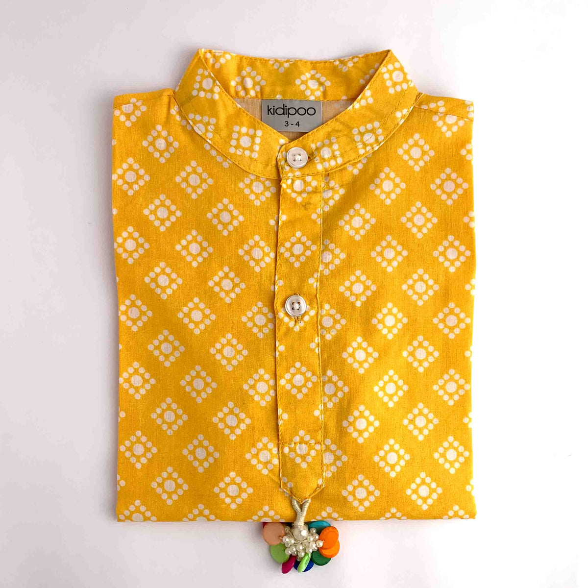 Kids yellow Badhni kurta with traditional white geometric print and cream pajama