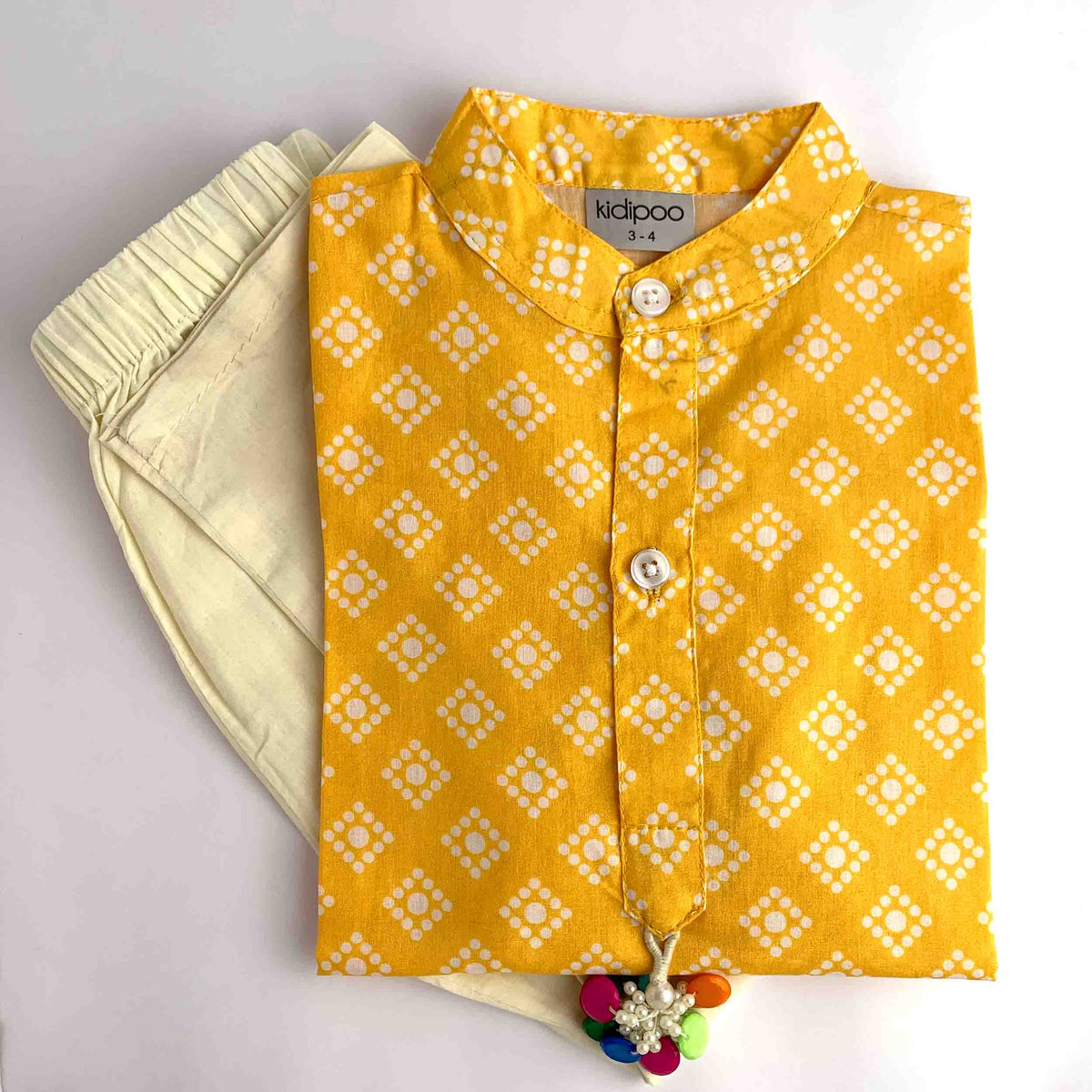 Yellow Badhni printed kurta pajama set for kids with cream pajama