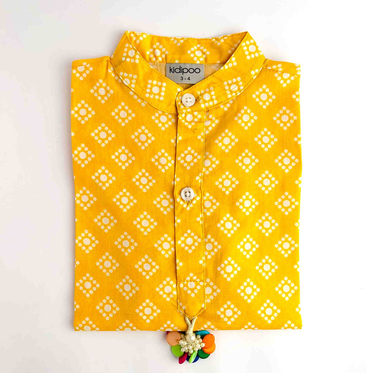 Yellow Bandhani Kurta for kids with a traditional white Bandhani print and button-front design.