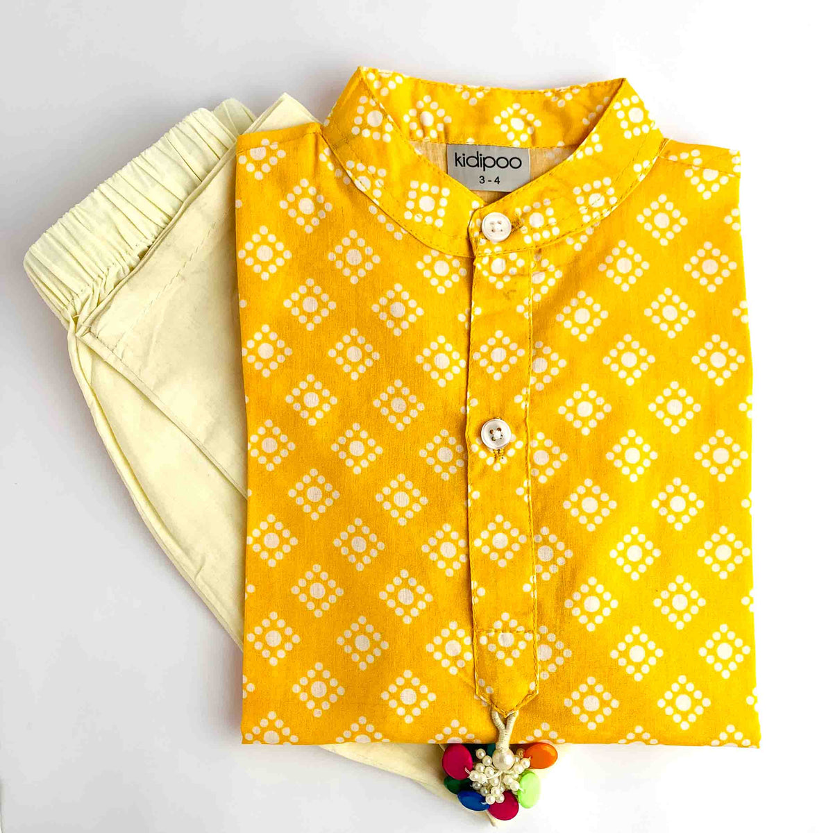 Yellow Bandhani Kurta Pajama for kids with a vibrant yellow Bandhani print kurta and cream pajama.