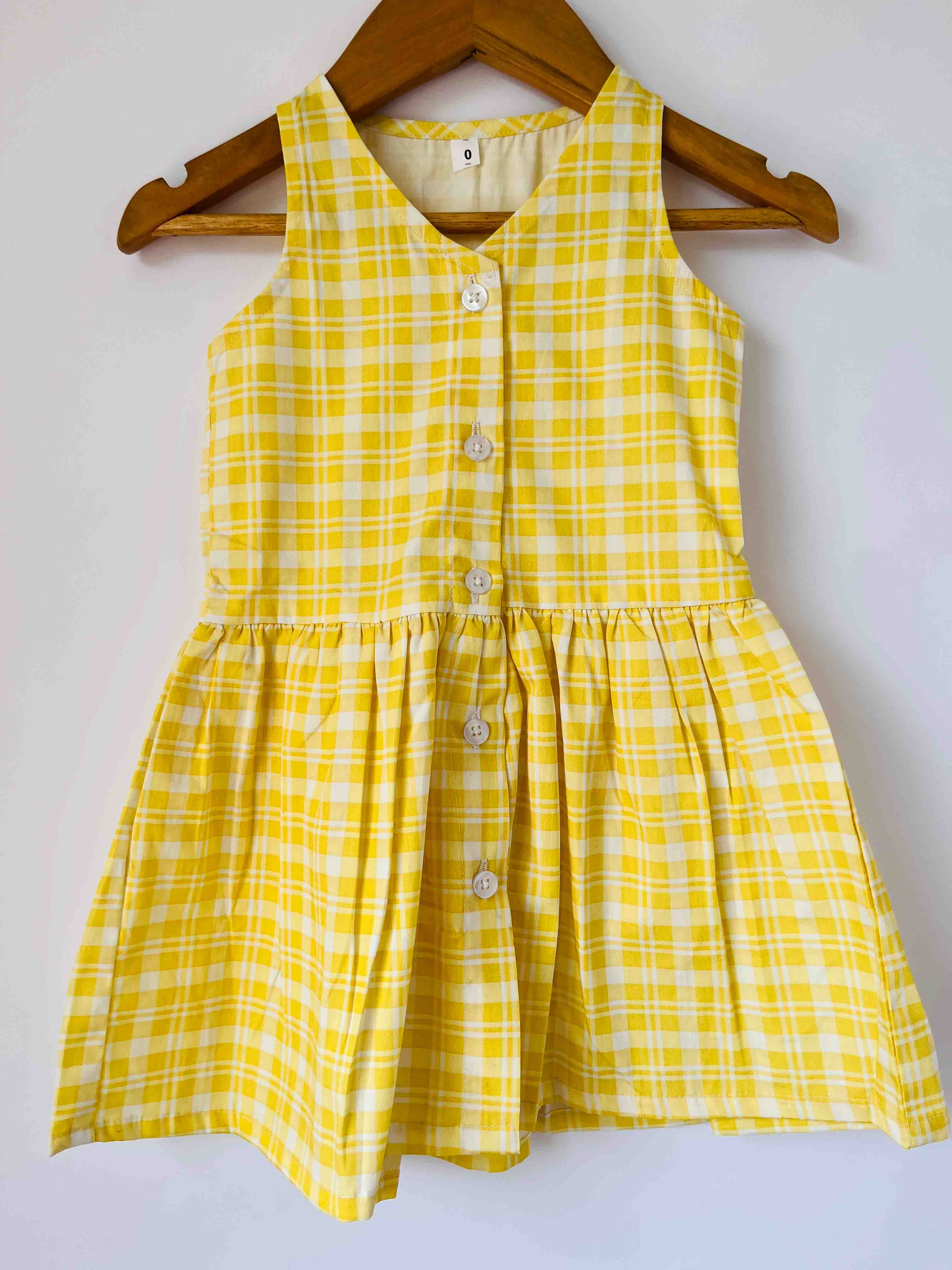 Cute yellow cotton dress for kids with sleeveless design and flared bottom
