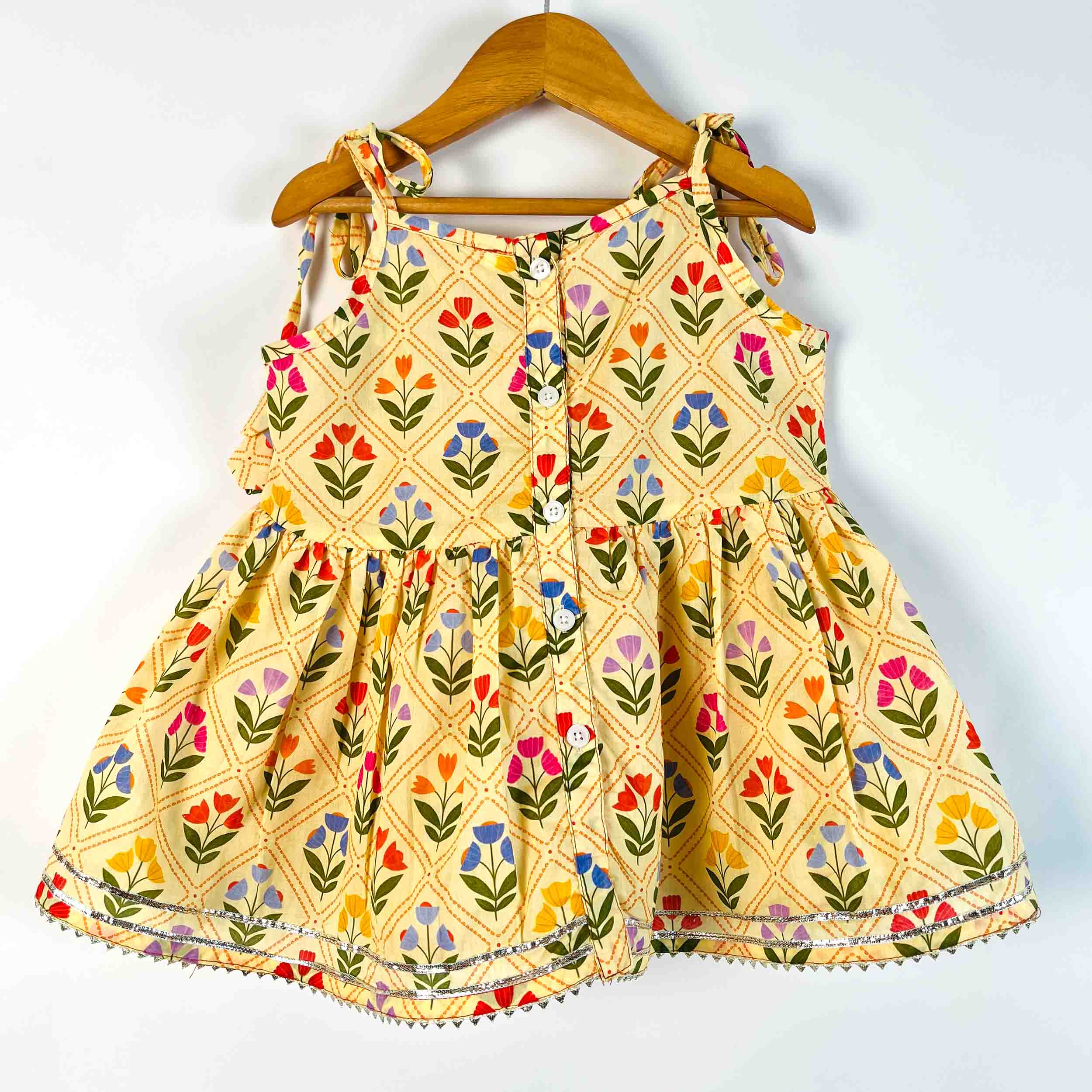 Girls Yellow Petals sleeveless printed cotton kurti back view with button closure